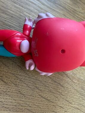 Source Unknown Red and Teal Kids Character Figure
